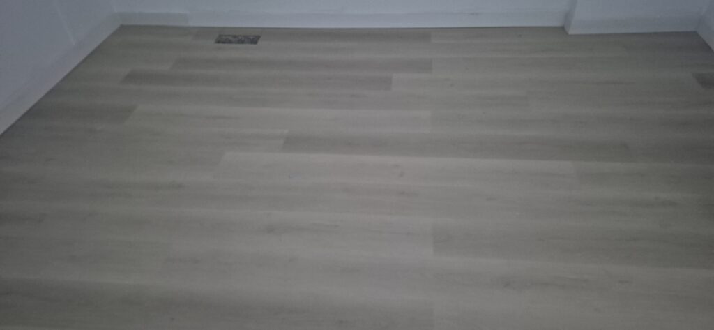 Newly installed light wood flooring in a Toronto-area home