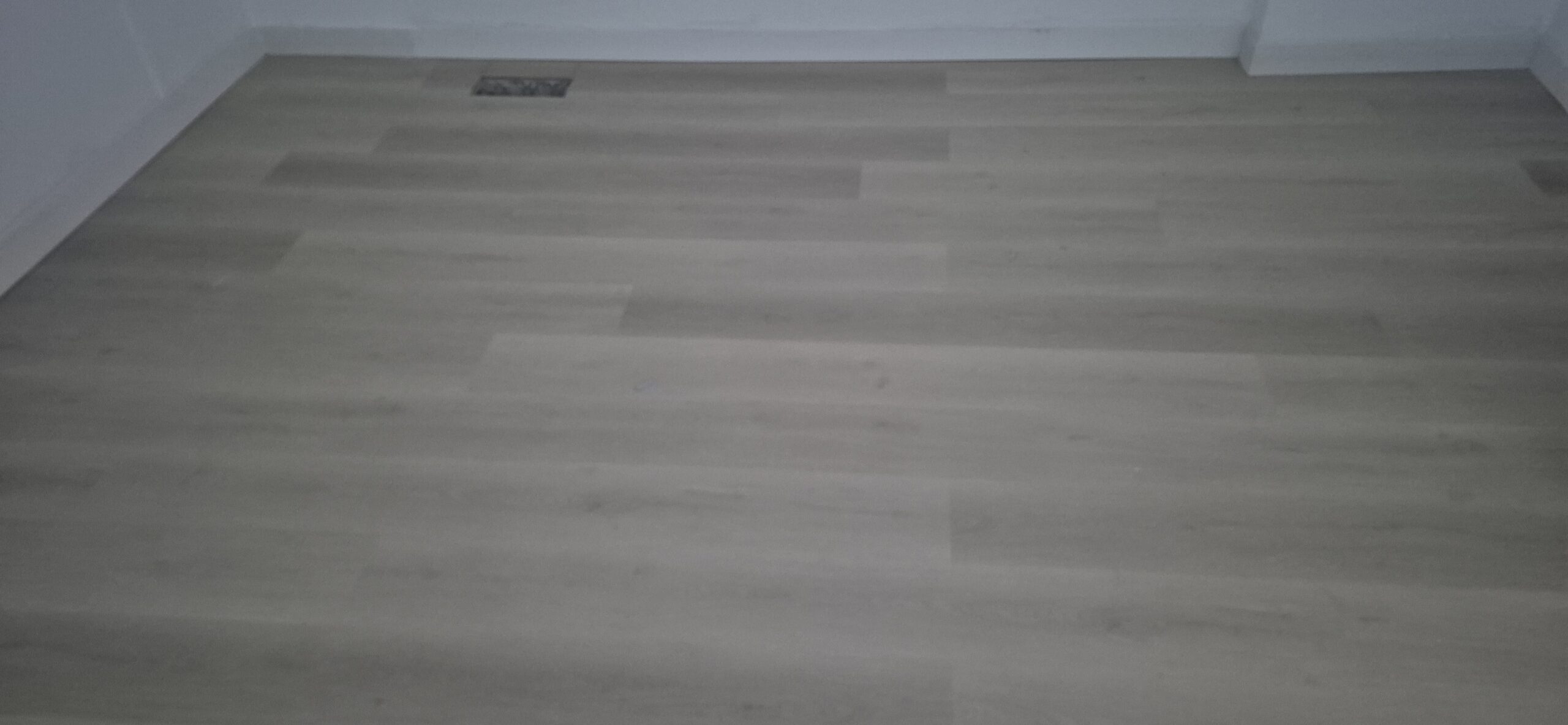Newly installed light wood flooring in a Toronto-area home