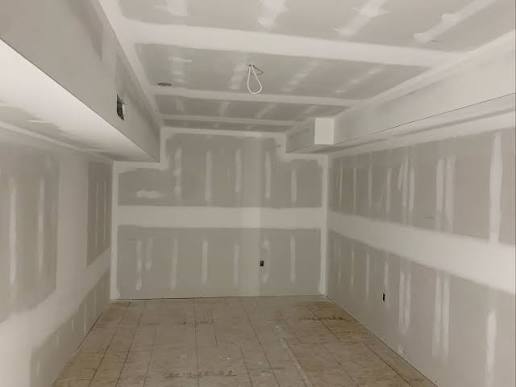 Installed drywall with taped and mudded joints in a Mississauga renovation