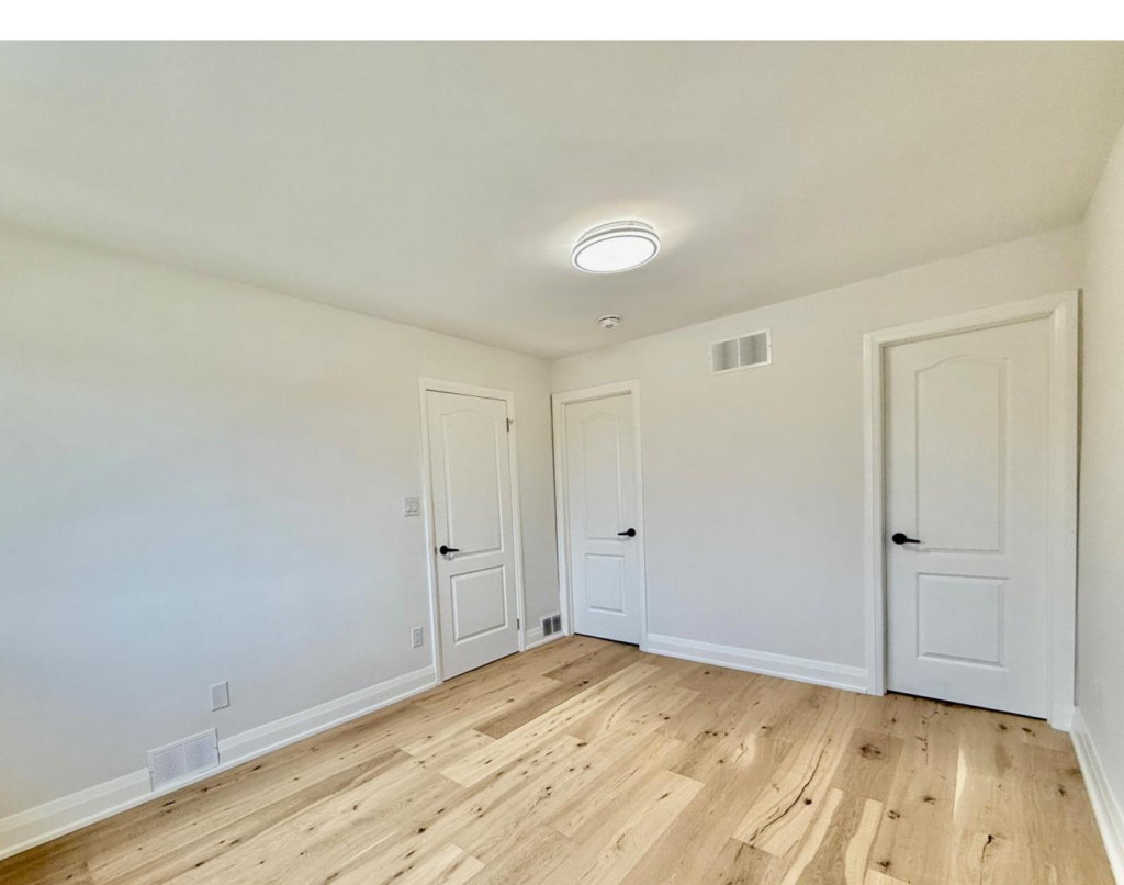 Finished interior doors, trim, and baseboards in a Toronto-area renovation